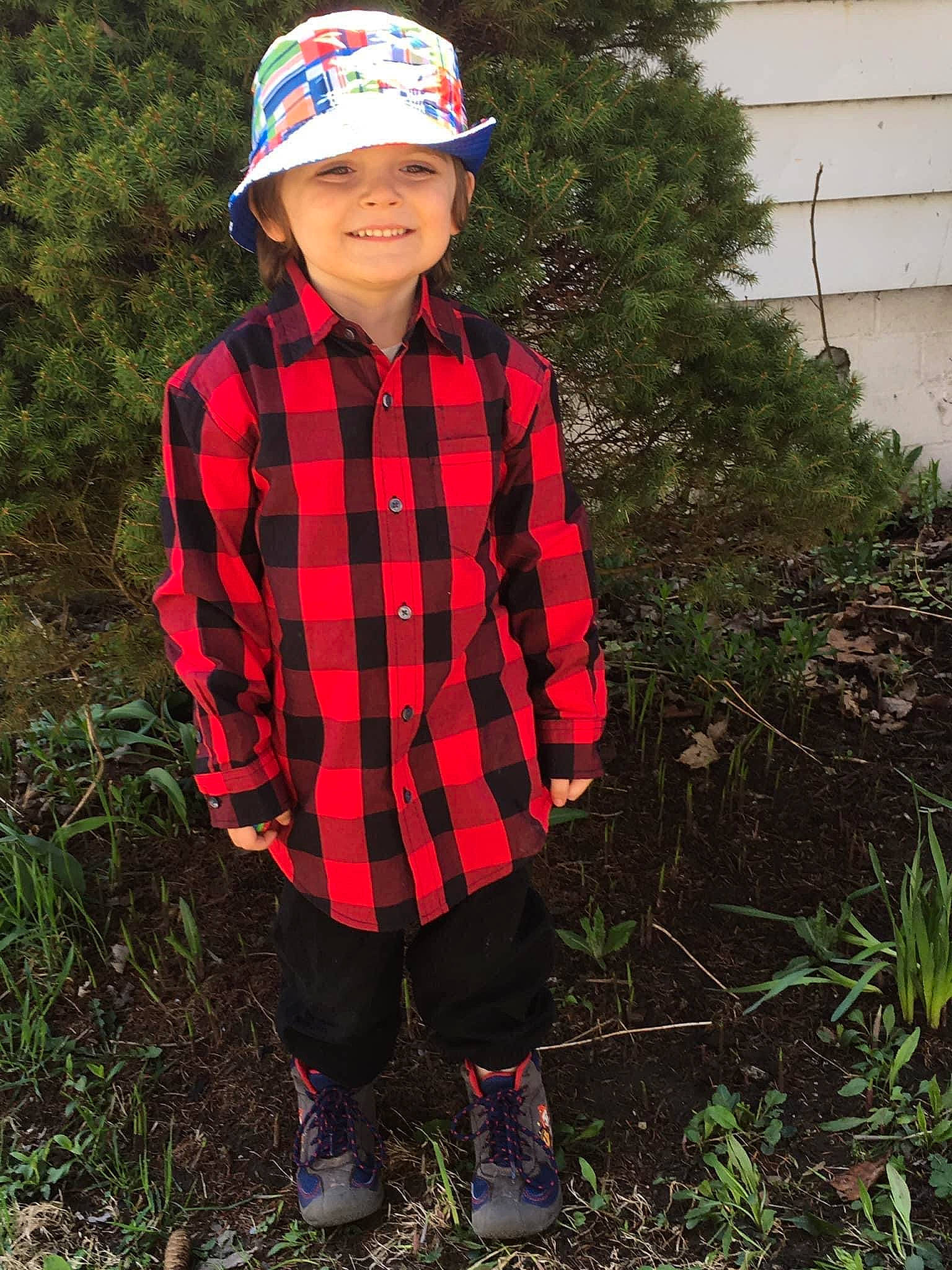 Dominic joined the competition — help win amazing prizes! cap, electric_blue, face, grass, hat, headgear, headwear, helmet, joy, outerwear, pattern, people_in_nature, person, personal_protective_equipment, plaid, plant, sleeve, smile, soil, street_fashion