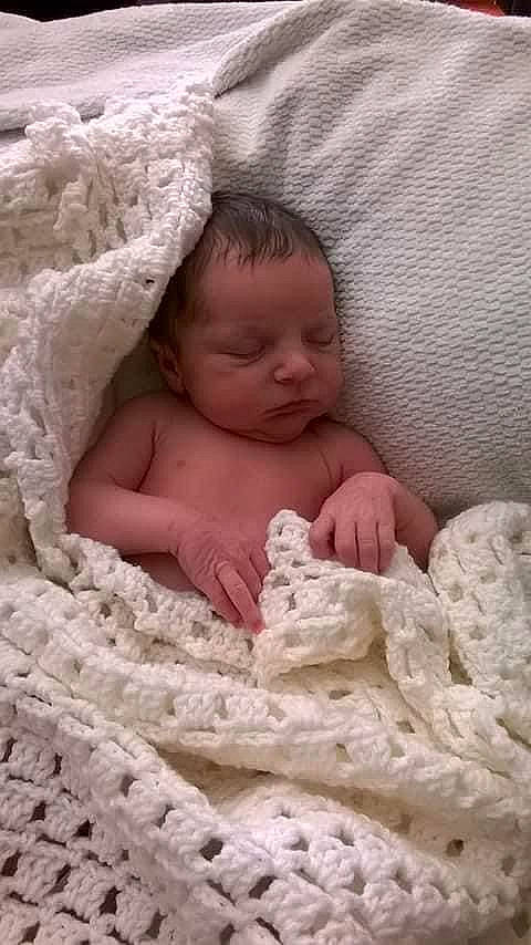 Dominic is registered to the contest to win money with this photo: baby, baby_toddler_clothing, bedding, bedtime, child, comfort, eye, flesh, fur, hand, linens, mammal, nose, person, room, sand, skin, textile, thumb, toddler