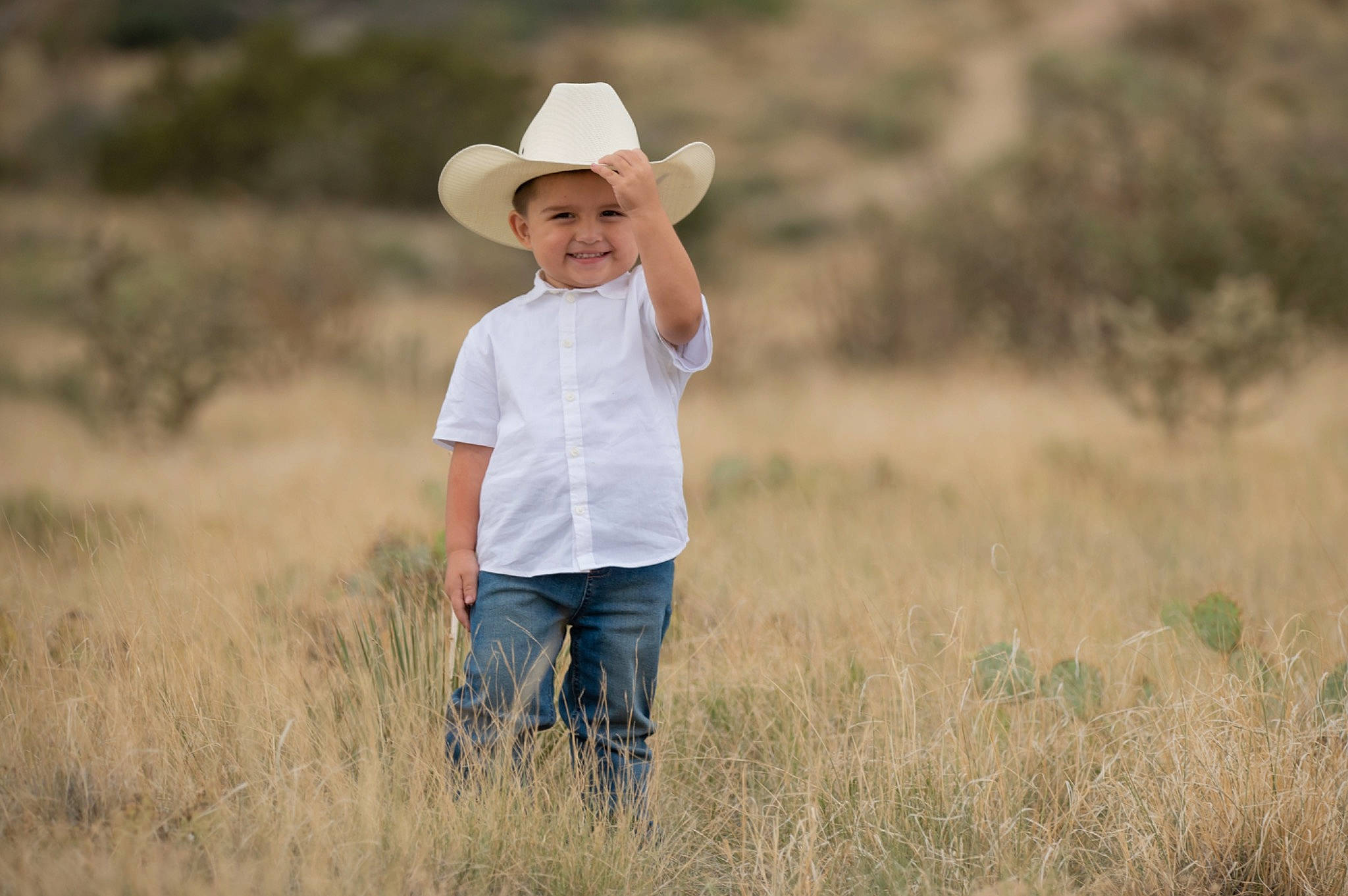 Royal is registered to the contest to win money with this photo: cap, child, cowboy_hat, flash_photography, fun, gesture, grass, grassland, happy, hat, headwear, joy, landscape, meadow, natural_landscape, people_in_nature, person, plant, prairie, standing