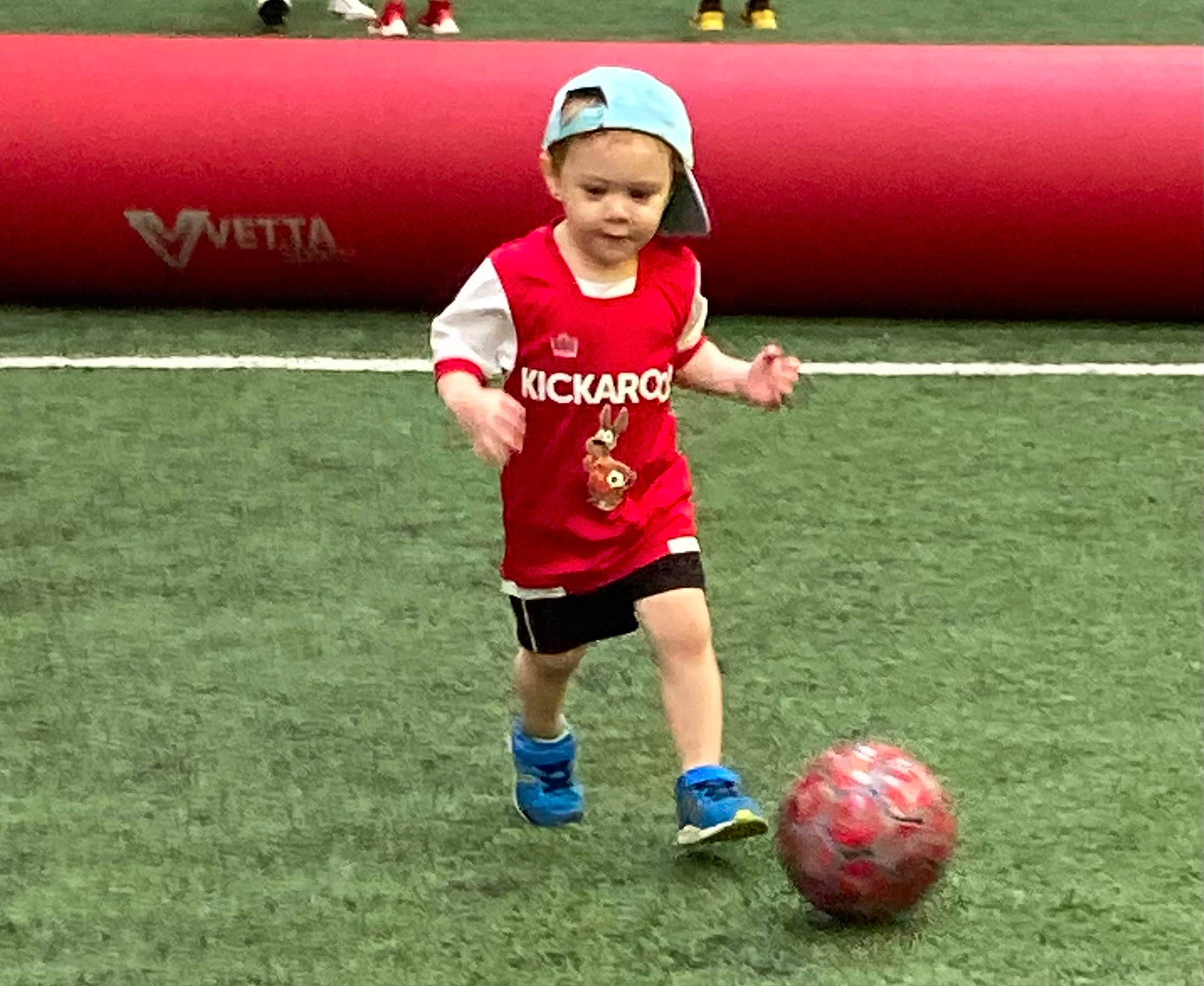 Ozzy joined the competition — help win amazing prizes! ball, ball_game, baseball_cap, cap, competition_event, football, fun, grass, hat, headwear, leisure, person, plant, player, recreation, shorts, soccer, soccer_ball, sports, sports_equipment