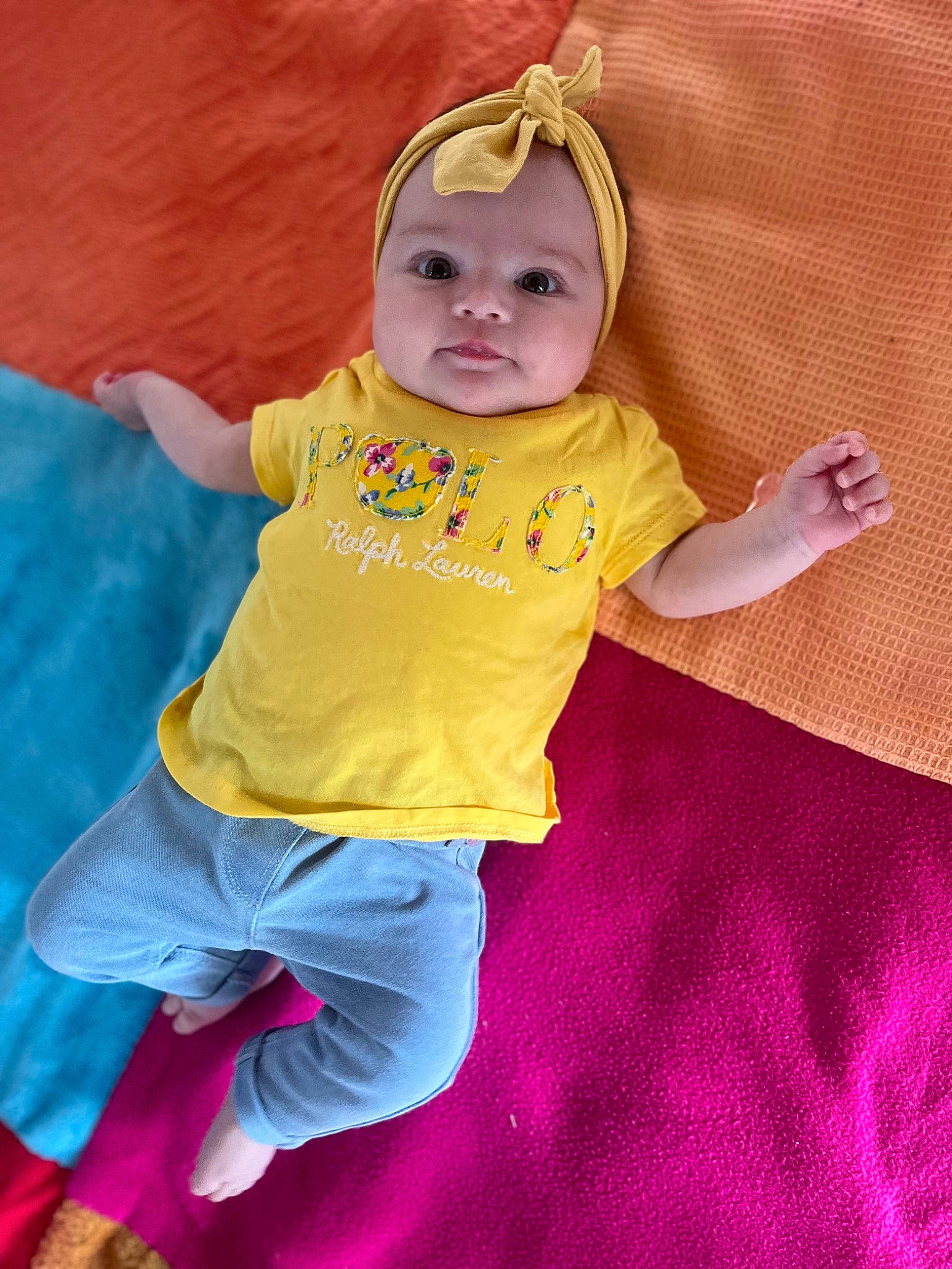 Alya participe au concours pour gagner de l'argent avec cette photo : baby, baby_products, baby_toddler_clothing, cheek, child, eye, fun, happy, headwear, linens, magenta, pattern, peach, person, pink, purple, sitting, sleeve, t_shirt, textile