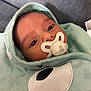 Hector participe au concours pour gagner de l'argent avec cette photo : baby, pacifier, blanket, hood, face, infant, closeup, soft_texture, blue_eyes, cute, newborn, swaddled, sleepy_bunny, fabric, cozy, portrait, indoor, child, expression, wrapped