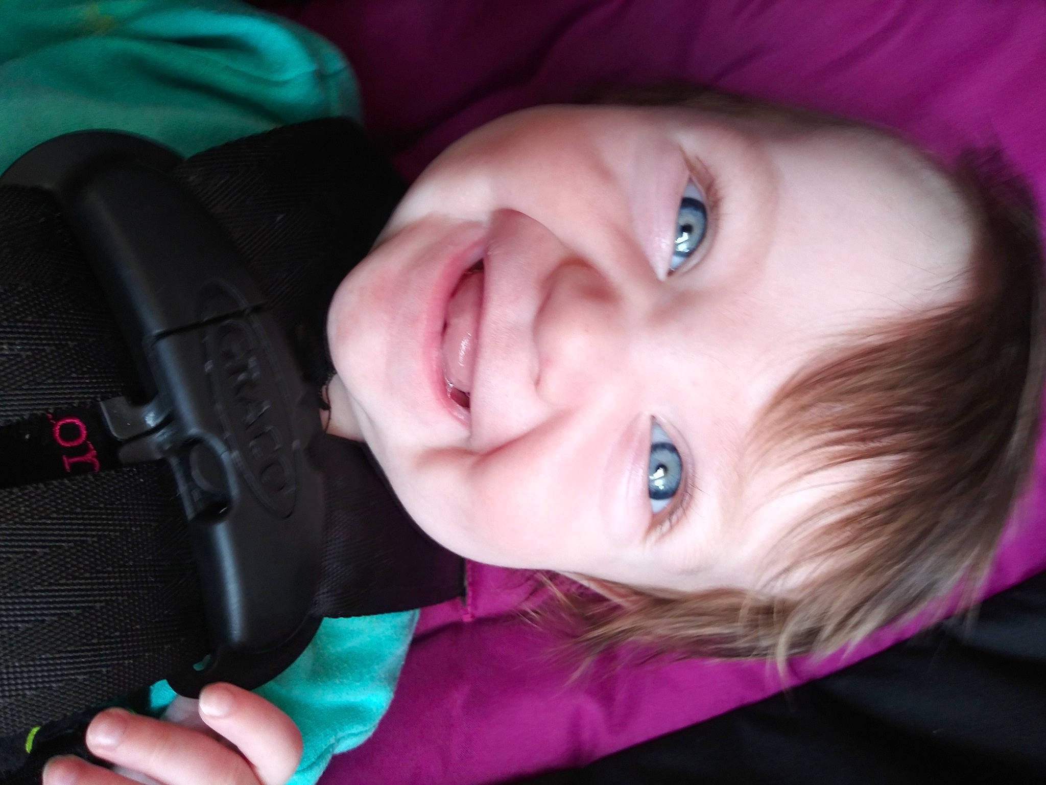 Armani is registered to the contest to win money with this photo: baby, black, cheek, chin, ear, eyebrow, eyelash, finger, happy, human_body, iris, joy, lip, mouth, nose, person, pink, product, purple, skin