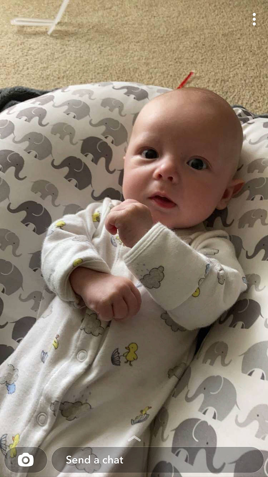 Brooks is registered to the contest to win money with this photo: baby, baby_products, baby_safety, baby_toddler_clothing, bedding, carmine, cheek, child, chin, comfort, face, linens, lip, pattern, person, room, sitting, skin, sleeve, textile