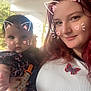 baby, woman, selfie, cat_ears_filter, heart_doodles, outdoor, pacifier_clip, butterfly_patch, red_hair, white_shirt, cute, playful, portrait, holding_baby, face, smiling, child, young_woman, casual_clothing, daylight