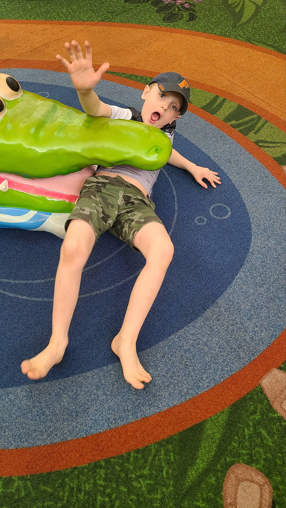 Robert joined the competition — help win amazing prizes! arm, balance, barefoot, child, circle, comfort, flooring, foot, fun, grass, green, headwear, human_body, human_leg, knee, leisure, person, play, recreation, shorts