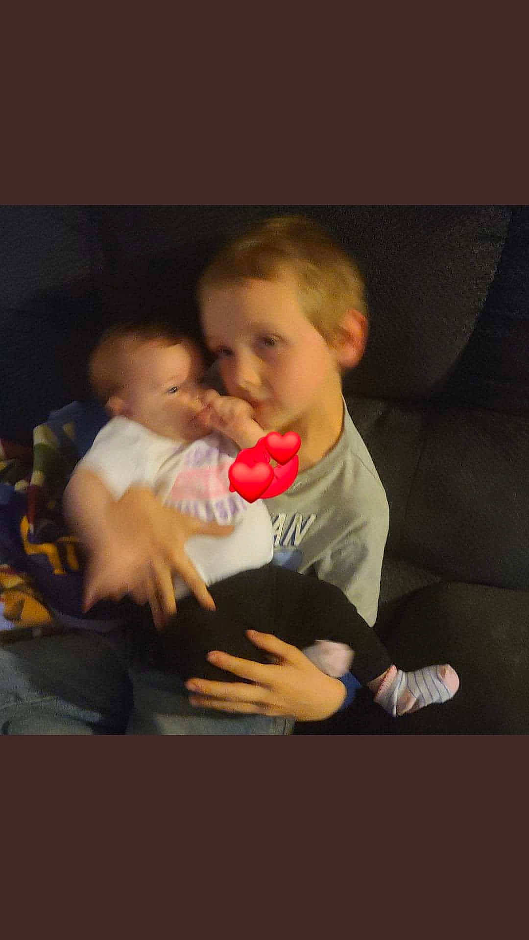 Robert is registered to the contest to win money with this photo: baby, baby_products, chair, cheek, child, comfort, couch, finger, flash_photography, fun, gesture, hand, happy, hug, lap, love, person, room, sitting, t_shirt