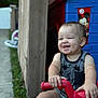 Amor is registered to the contest to win money with this photo: toddler, child, smiling, tricycle, toy, outdoor, playhouse, mickey_mouse, plastic, fence, grass, sidewalk, diaper, tank_top, happy, baby, person, cute, playtime, summer