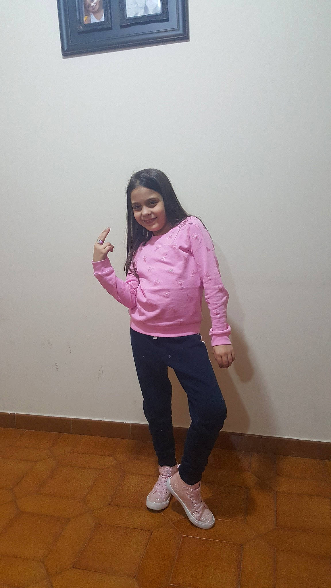 Giulia is registered to the contest to win money with this photo: arm, joint, joy, knee, outerwear, person, pink, shoe, shoulder, standing, white