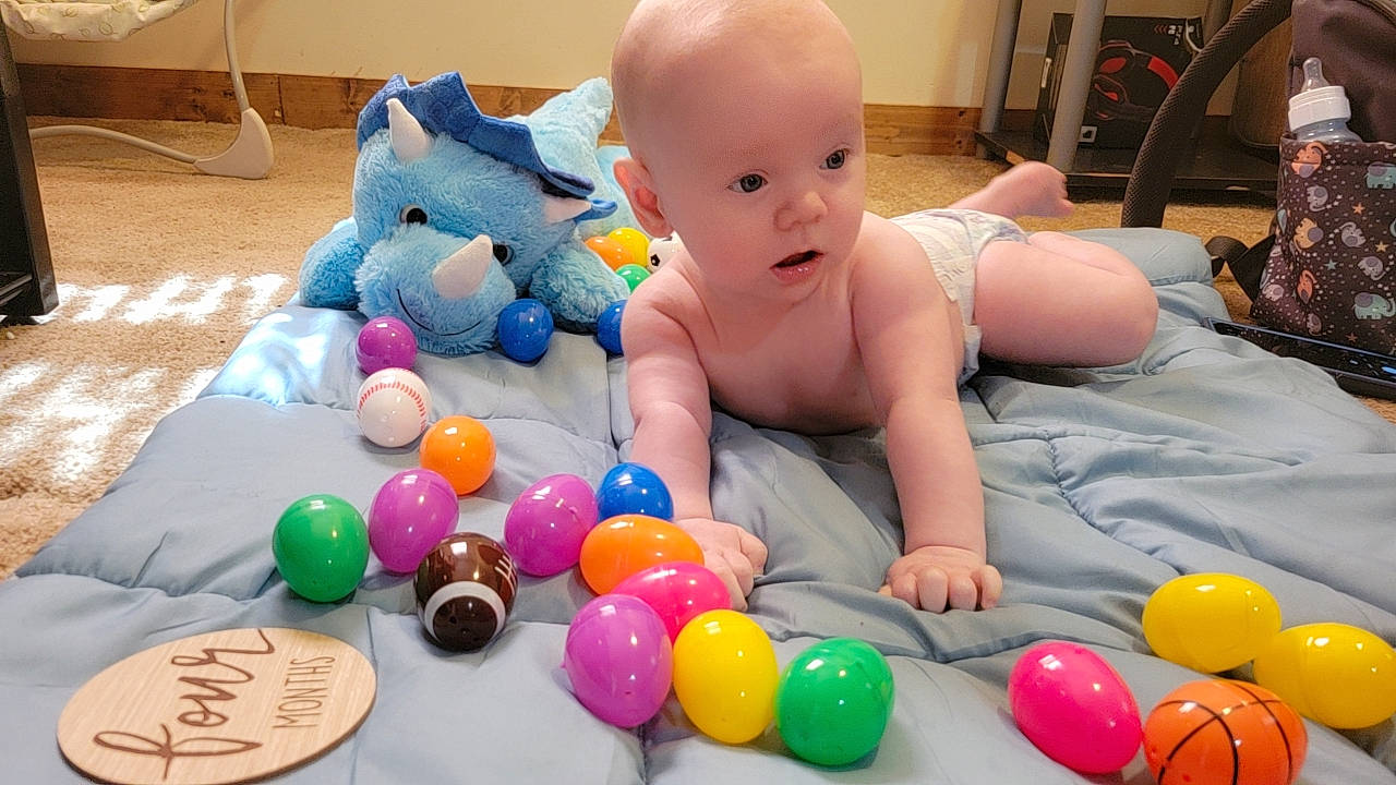 Bentley is registered to the contest to win money with this photo: baby, baby_playing_with_toys, baby_toys, ball_pit, balloon, child, comfort, event, fun, leisure, party_supply, people, person, photograph, play, room, sitting, snapshot, surprise, toddler