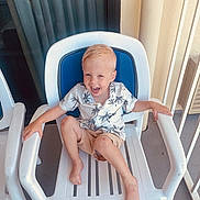 Grayson joined the competition — help win amazing prizes! architecture, armchair, baby, balcony, building, chair, clothing, cushion, face, furniture, head, homedecor, person, photography, portrait, rockingchair, shorts, sitting, summer, t_shirt
