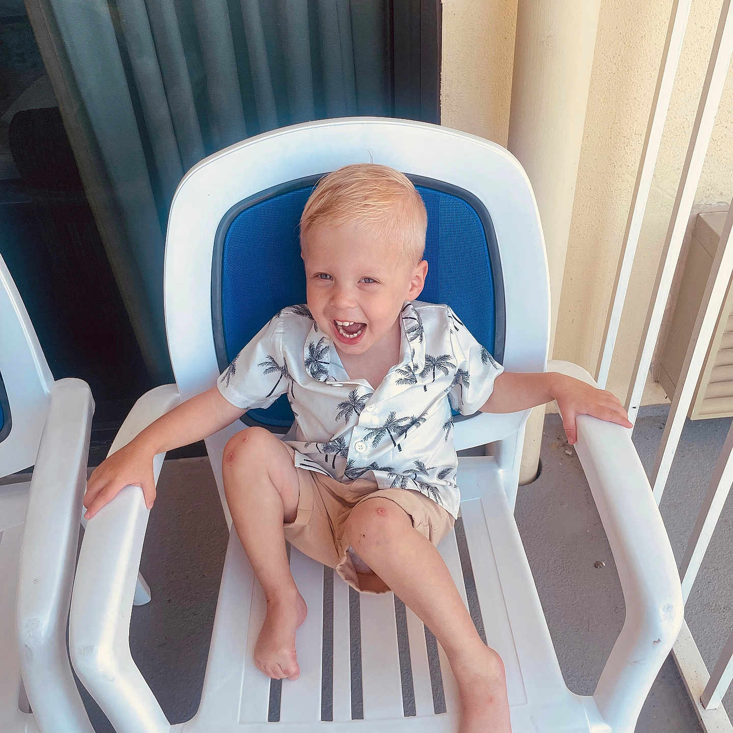 Grayson joined the competition — help win amazing prizes! architecture, armchair, baby, balcony, building, chair, clothing, cushion, face, furniture, head, homedecor, person, photography, portrait, rockingchair, shorts, sitting, summer, t_shirt