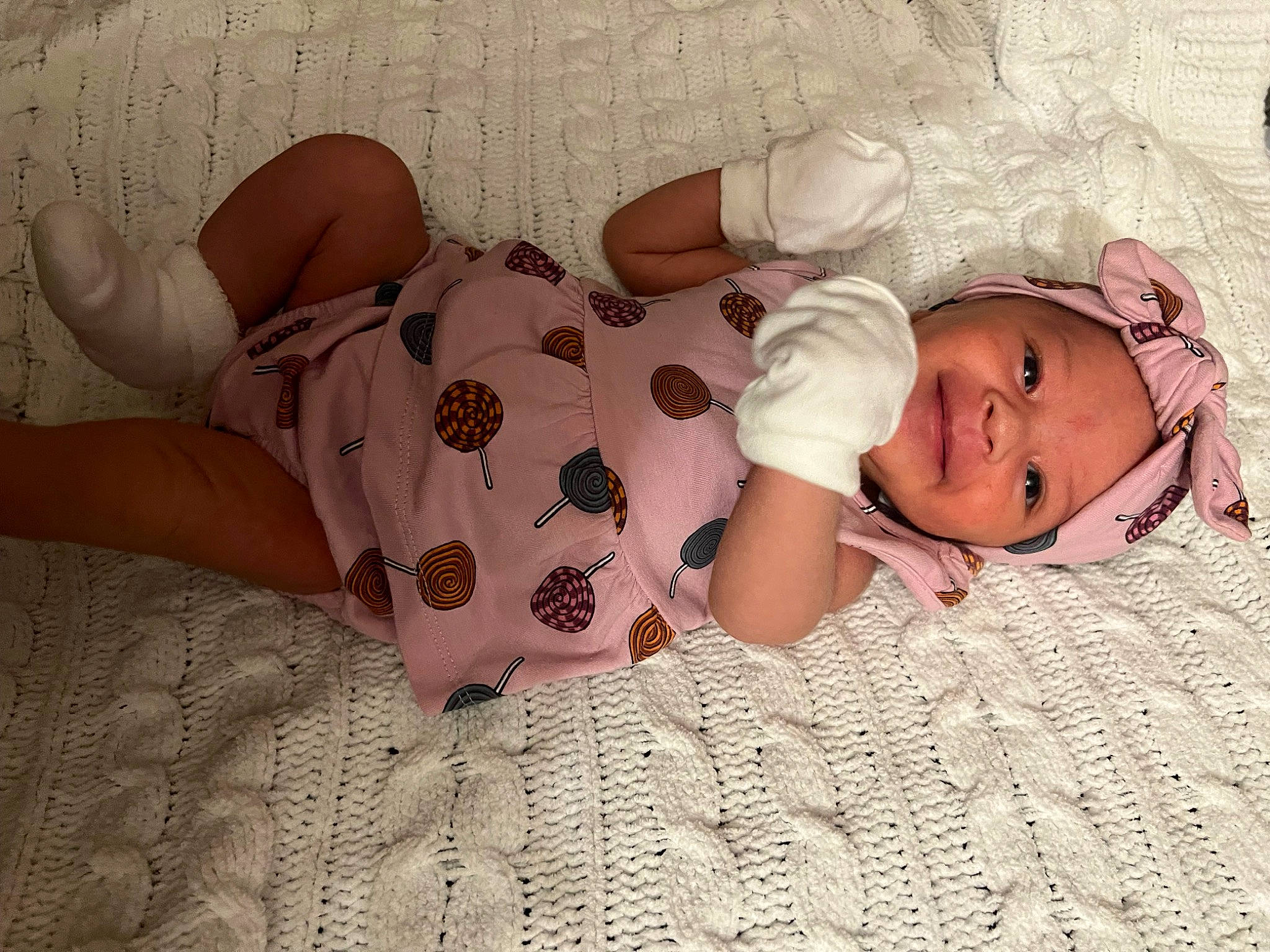 Weslynn is registered to the contest to win money with this photo: arm, baby, baby_sleeping, baby_toddler_clothing, bedding, comfort, finger, flooring, hand, headgear, headwear, human_body, human_leg, leg, linens, mouth, pattern, person, skin, sleeve