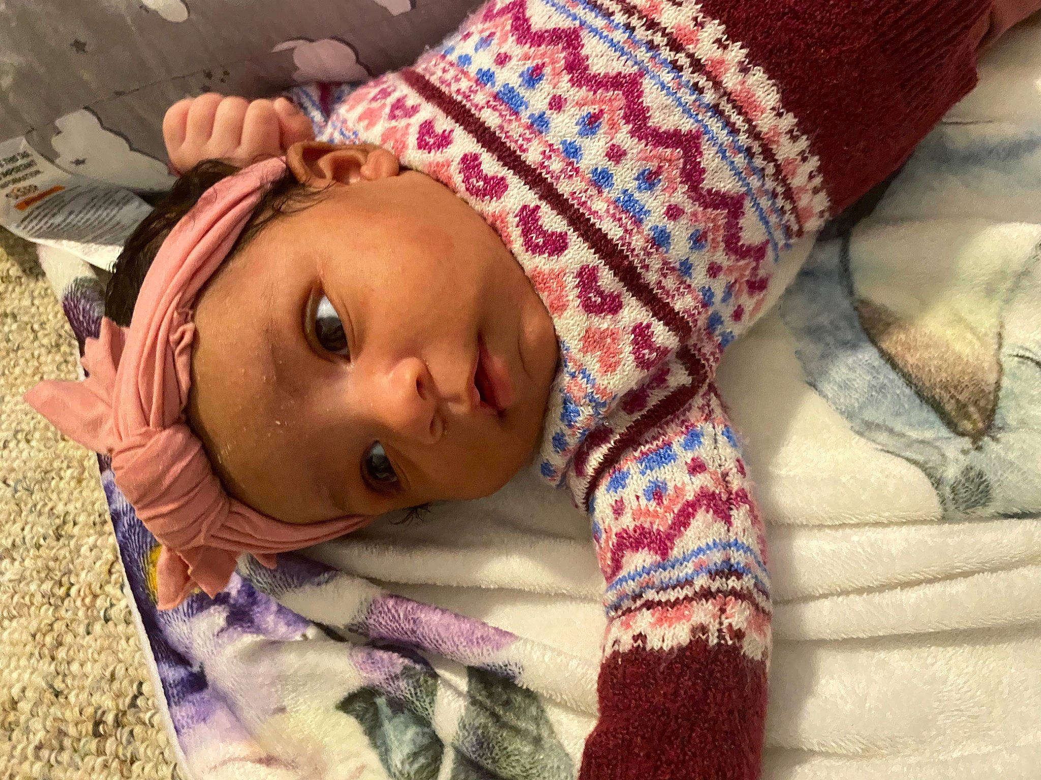Layoni is registered to the contest to win money with this photo: baby, baby_toddler_clothing, cheek, child, chin, comfort, eyebrow, eyelash, happy, headwear, iris, linens, lip, mouth, nose, person, pink, purple, skin, sleeve