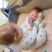 Cassie is registered to the contest to win money with this photo: baby, babies, child, infant, playpen, pacifier, toy, dinosaur_toy, pajamas, sleepwear, mesh_sides, crib, crawling, floor, indoor, cute, smiling, playtime, soft_bedding, young_children
