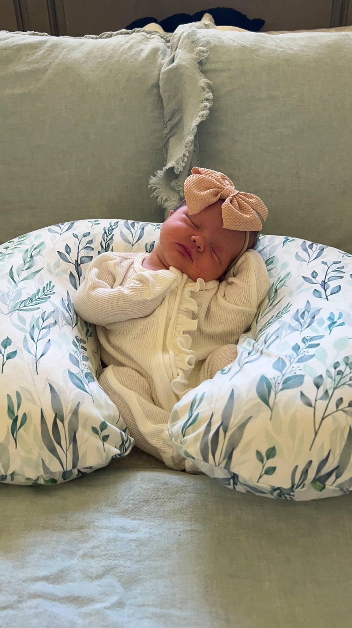 Rylan is registered to the contest to win money with this photo: baby, baby_products, baby_sleeping, bed, bed_sheet, bedding, bedroom, bedtime, comfort, flooring, hat, headwear, human_body, linens, nap, pattern, person, room, sitting, sleeve