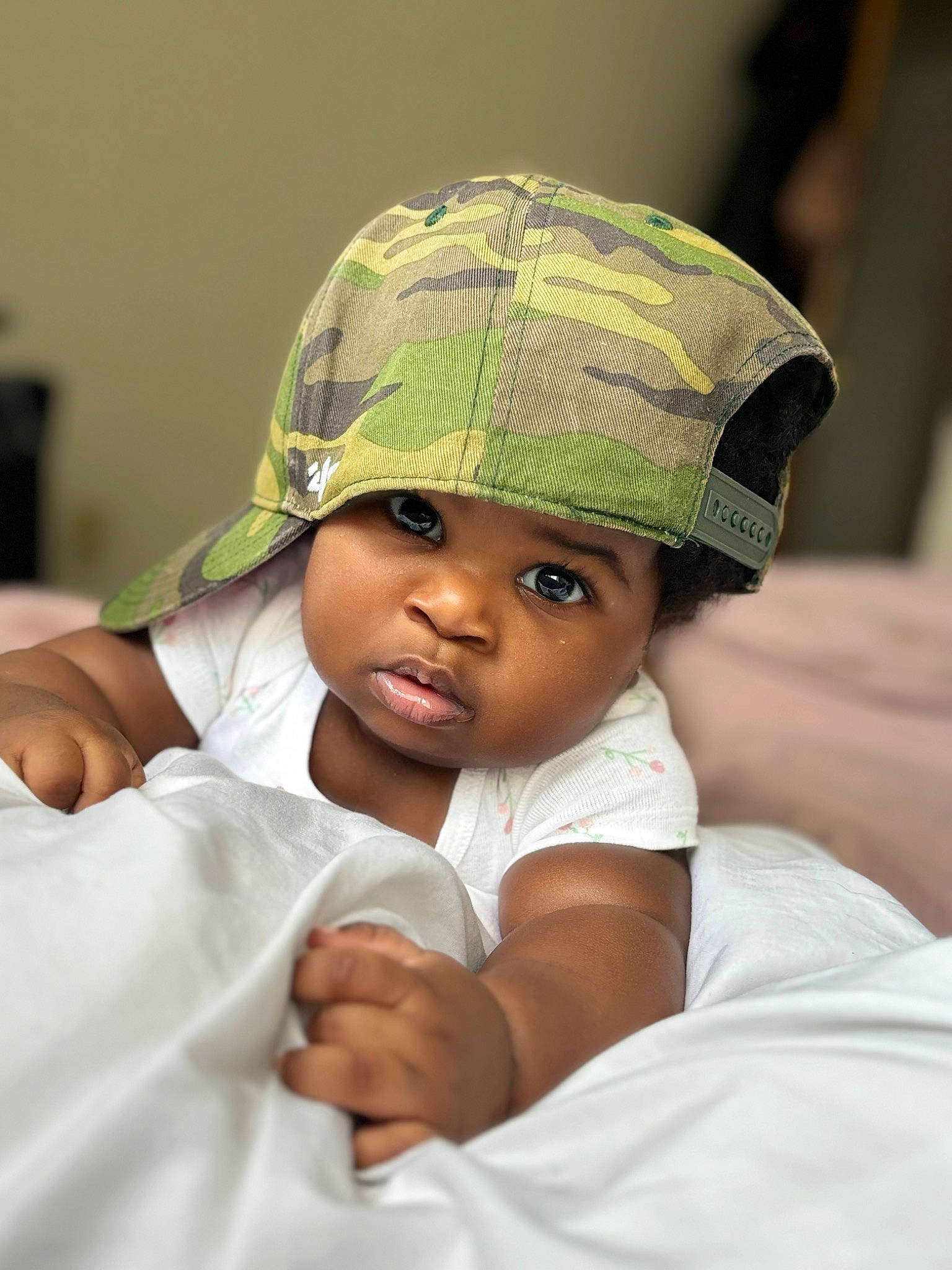 Ivy is registered to the contest to win money with this photo: baby, baby_toddler_clothing, cap, child, comfort, elbow, eye, fashion_accessory, flash_photography, gesture, happy, hat, headgear, headwear, person, portrait_photography, sitting, sleeve, toddler