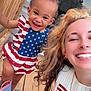 Jade joined the competition — help win amazing prizes! child, toddler, woman, smile, happy, american_flag, dress, boots, peppa_pig, wooden_deck, railing, window, reflection, curly_hair, piercing, necklace, tattoo, outdoor, person, portrait