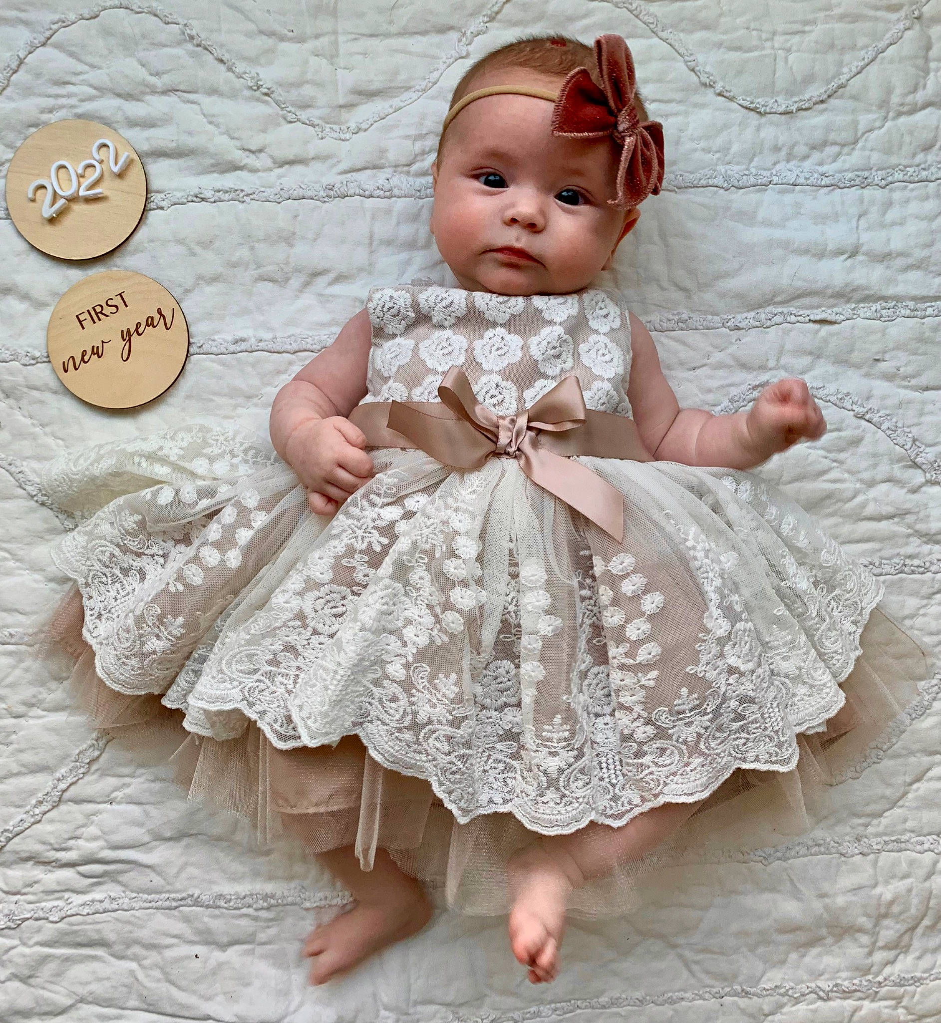 Isabelle is registered to the contest to win money with this photo: arm, baby_toddler_clothing, clothing, day_dress, dress, embellishment, eye, eyelash, finger, hand, happy, head, headwear, iris, one_piece_garment, organ, person, pink, skin, sleeve
