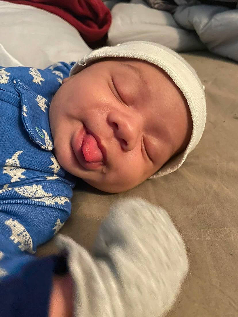 Carlos joined the competition — help win amazing prizes! baby, baby_sleeping, baby_toddler_clothing, bedtime, carmine, cheek, child, comfort, eye, eyebrow, face, head, headwear, iris, linens, lip, nap, nose, person, sleep