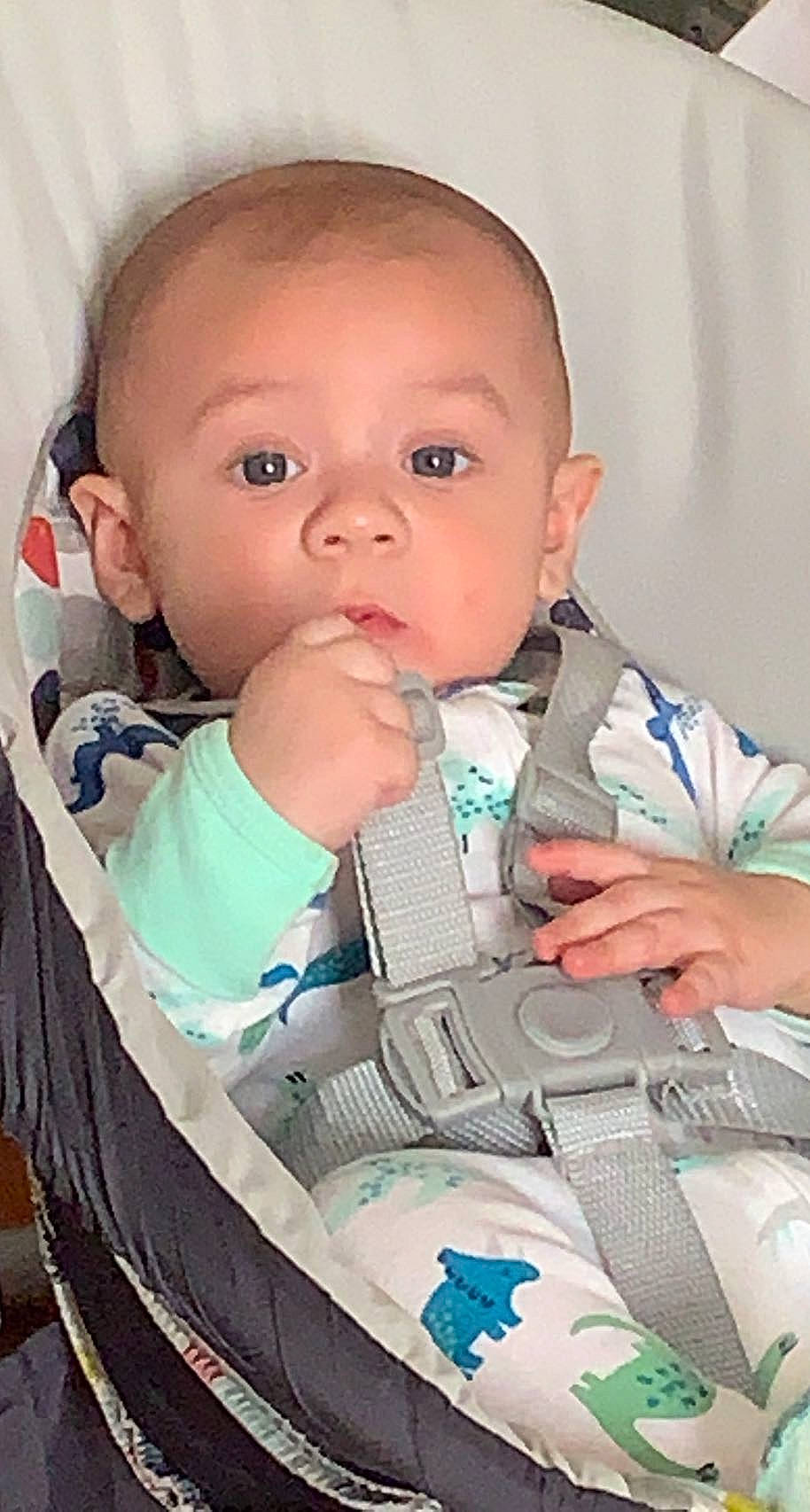 Carlos is registered to the contest to win money with this photo: baby, baby_products, baby_safety, baby_toddler_clothing, cheek, child, chin, collar, comfort, eye, eyebrow, finger, iris, lip, mouth, neck, nose, person, skin, sleeve