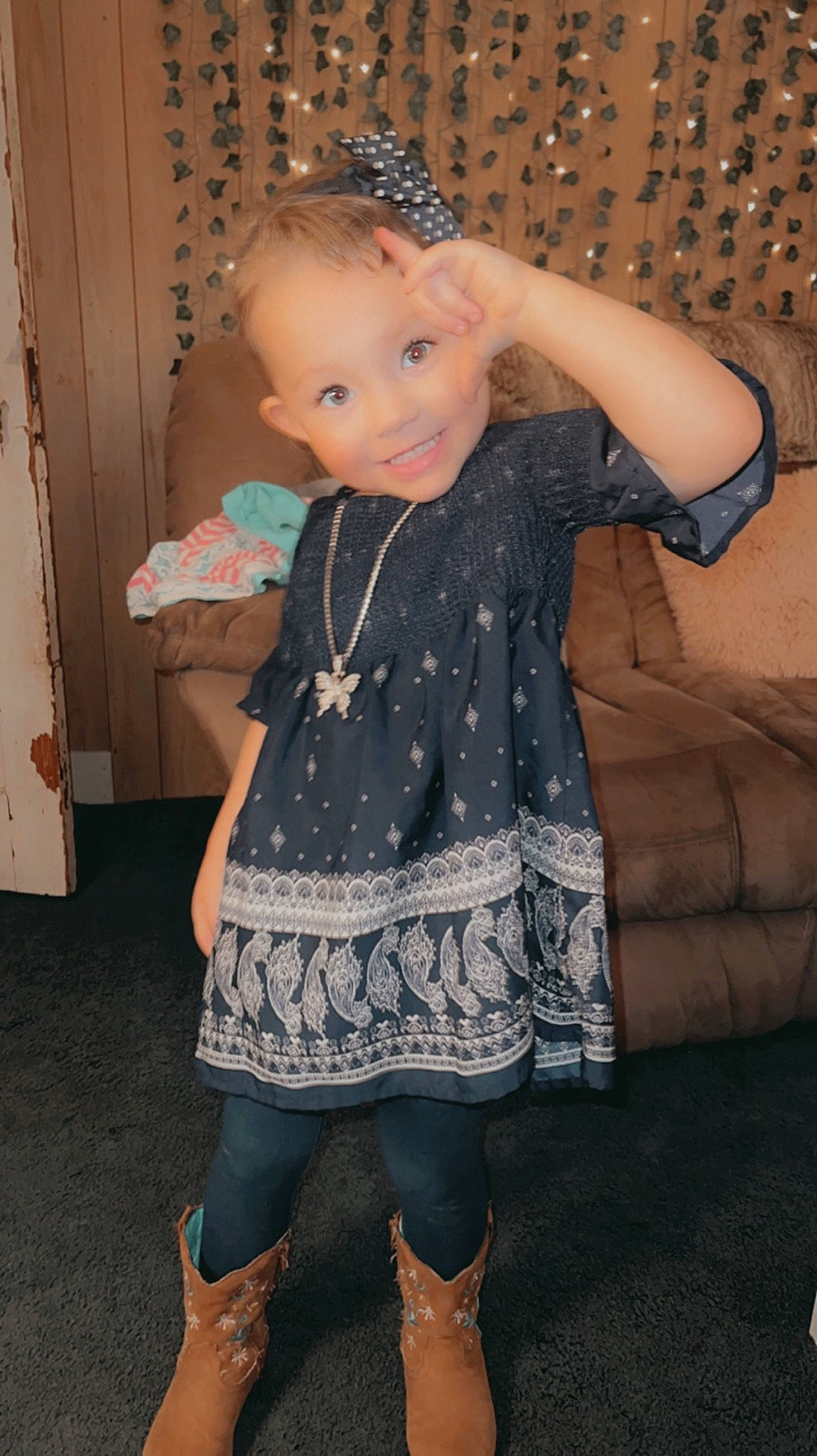 Kinsley joined the competition — help win amazing prizes! baby_toddler_clothing, child, couch, day_dress, dress, embellishment, eye, facial_expression, flash_photography, iris, joint, joy, knee, one_piece_garment, pattern, people, person, skin, sleeve, standing