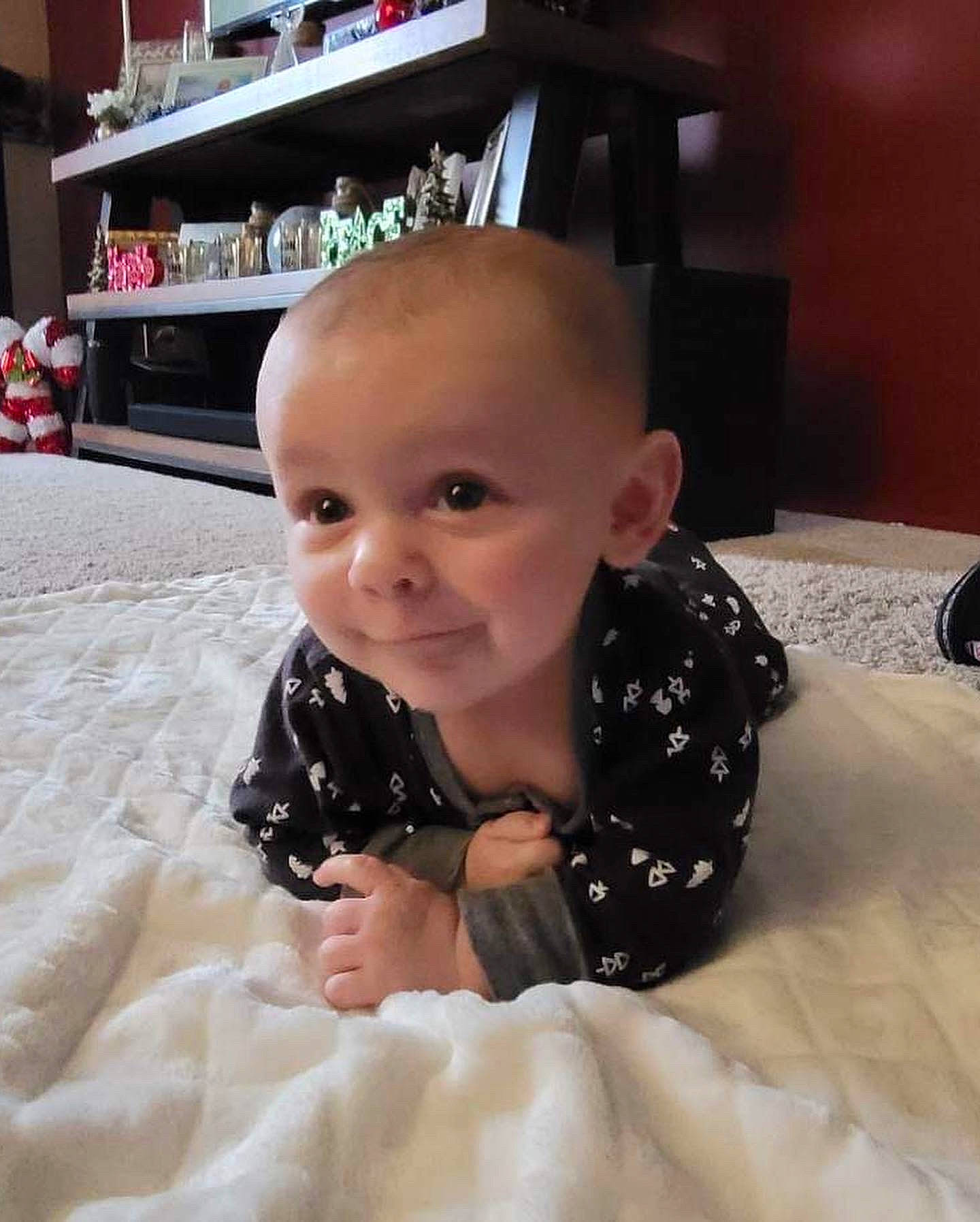 Brantley joined the competition — help win amazing prizes! baby, baby_toddler_clothing, carpet, cheek, child, comfort, floor, flooring, fun, happy, joy, linens, pattern, person, room, shelf, sitting, skin, sleeve, smile