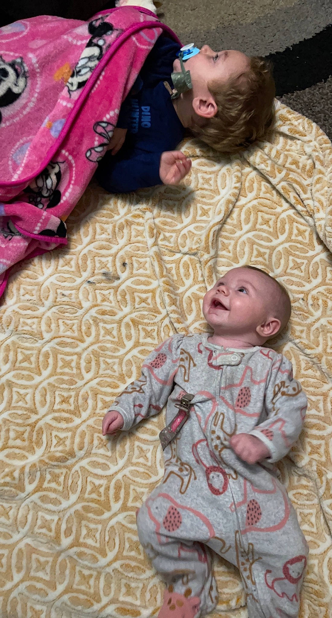 Aubree is registered to the contest to win money with this photo: baby, baby_toddler_clothing, cheek, child, comfort, flooring, fun, grass, happy, linens, pattern, people, person, pink, red, skin, sleeve, textile, toddler, white