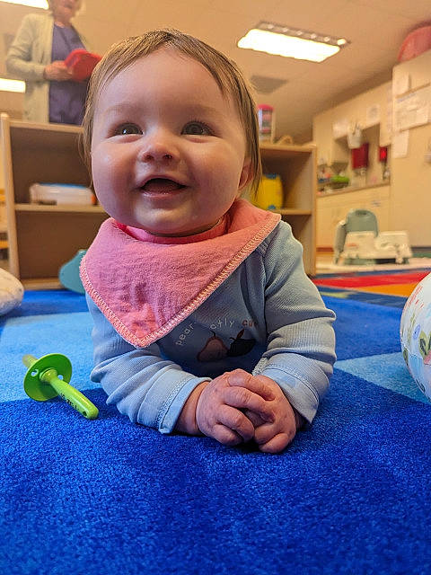 Genevieve joined the competition — help win amazing prizes! baby, baby_toddler_clothing, cheek, child, finger, floor, flooring, fun, grass, happy, kindergarten, leisure, nose, person, play, product, recreation, room, skin, smile