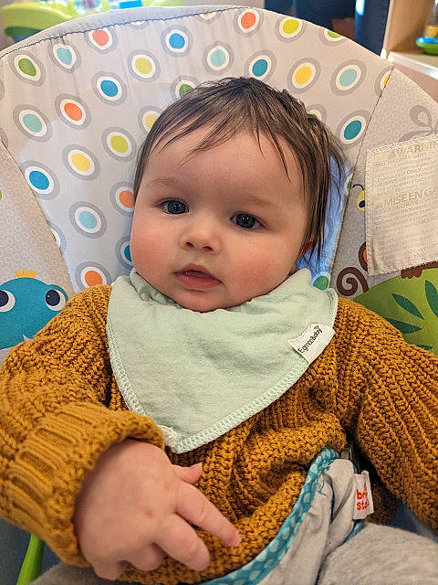 Genevieve is registered to the contest to win money with this photo: baby, baby_toddler_clothing, cheek, child, chin, comfort, eye, face, happy, head, headgear, iris, linens, nose, outerwear, person, photograph, skin, sleeve, textile