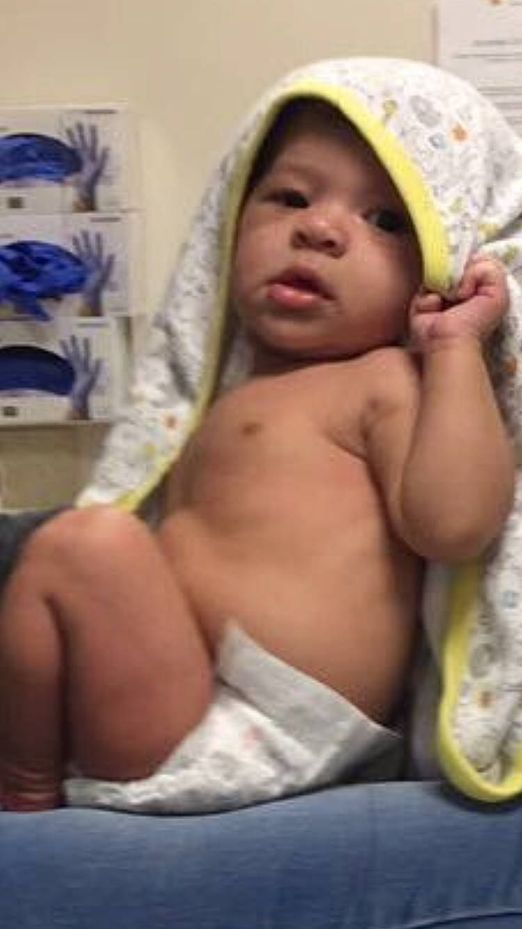 Kavon is registered to the contest to win money with this photo: abdomen, arm, barechestedness, chest, child, finger, girl, headwear, infant, muscle, person, trunk