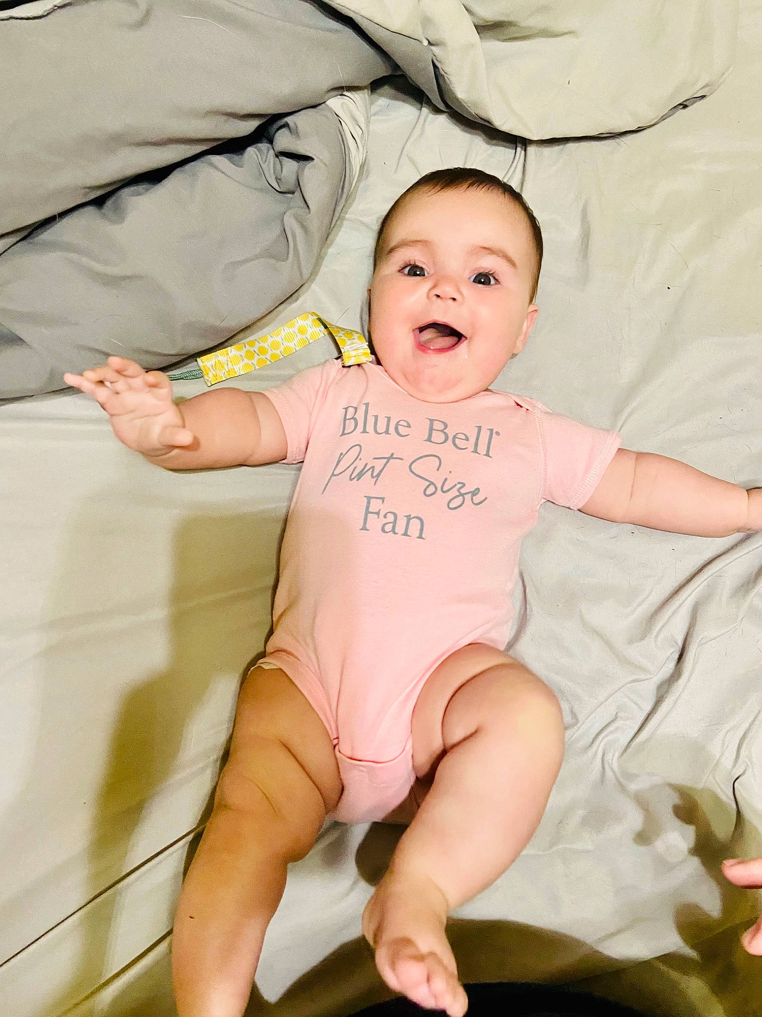 Jolene is registered to the contest to win money with this photo: arm, baby, baby_toddler_clothing, cheek, comfort, eye, face, finger, gesture, hand, happy, head, human_body, leg, mouth, person, skin, sleeve, smile, stomach
