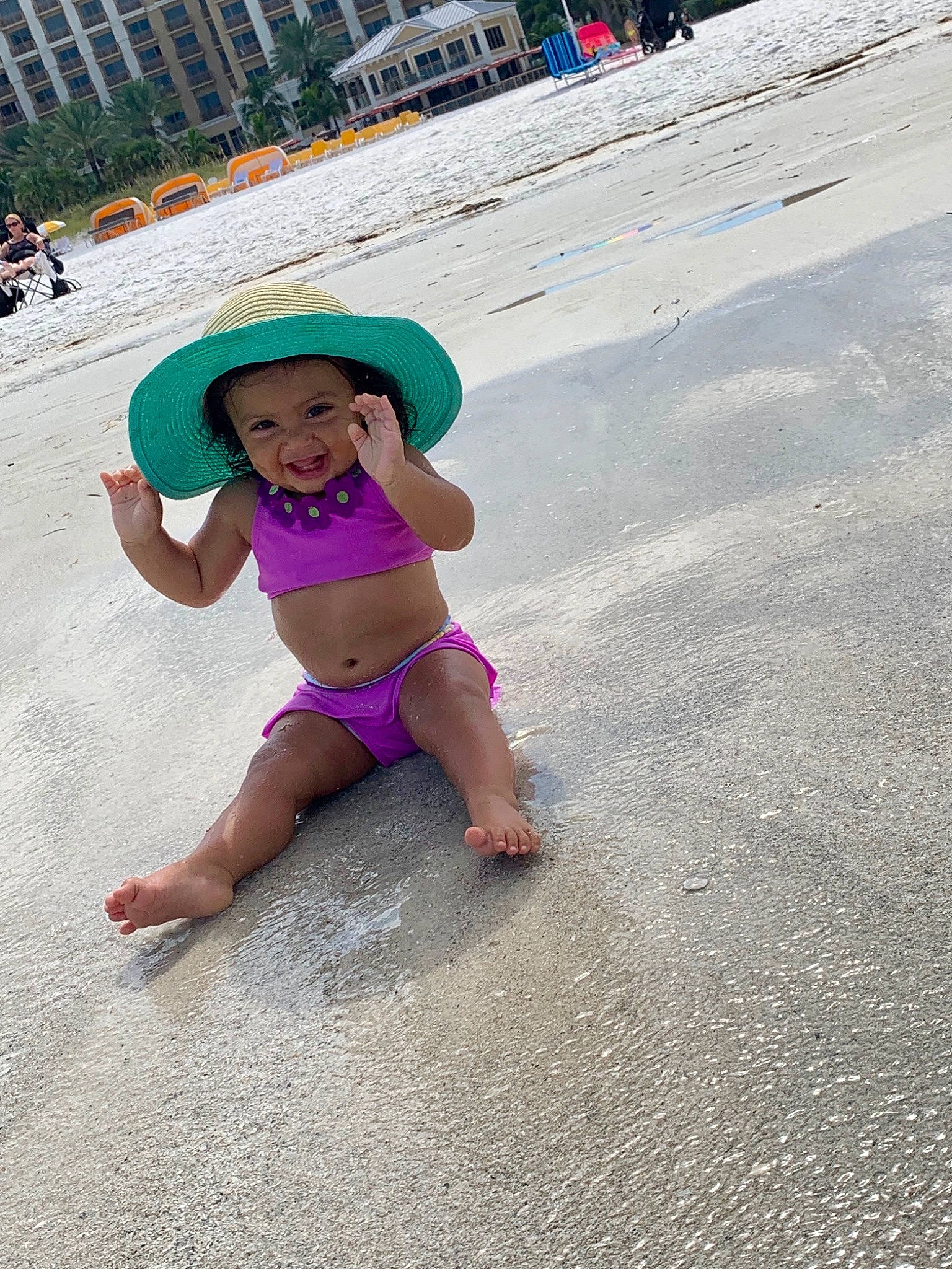 Amilia is registered to the contest to win money with this photo: barefoot, beach, child, fashion_accessory, fun, hat, headgear, headwear, joy, leg, leisure, person, pink, play, road_surface, sand, sea, smile, summer, sun_hat
