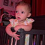 Xzanna joined the competition — help win amazing prizes! baby, crib, child, indoor, curious, standing, railing, clothing, dress, furniture, room, curtain, soft_lighting, expression, hand, face, person, home, bed, toy