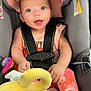 Xzanna joined the competition — help win amazing prizes! baby, child, car_seat, seatbelt, toy, plush_toy, pink_clothing, bow, smiling, blue_eyes, infant, cute, happy, sitting, indoor, safety, car_interior, foot, hand, toddler