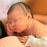 Prisa is registered to the contest to win money with this photo: baby, sleeping, infant, blanket, soft, skin, hand, arm, knitwear, closeup, peaceful, rest, newborn, portrait, cute, indoors, tender, calm, child, face