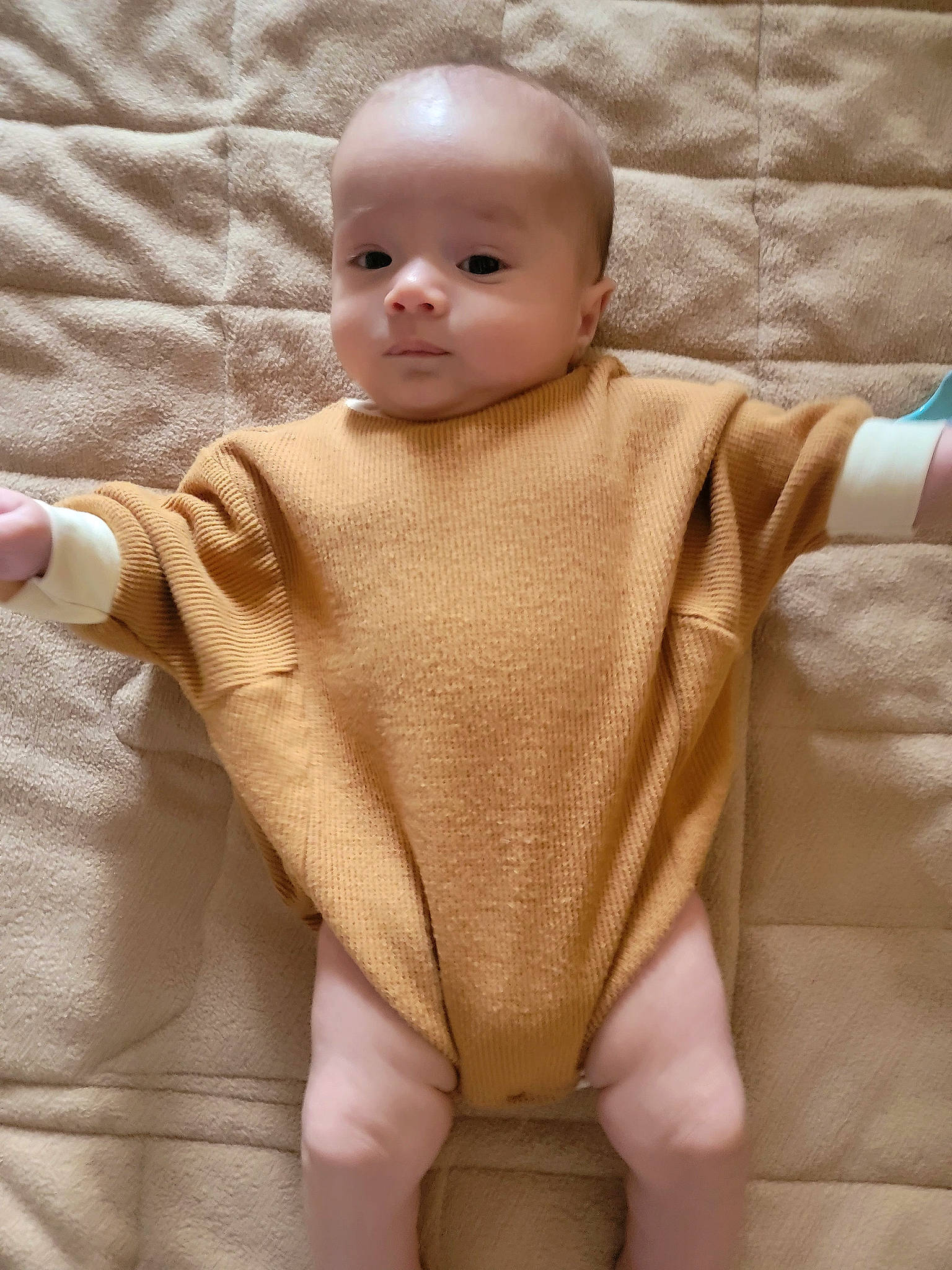 Julian is registered to the contest to win money with this photo: arm, baby, baby_toddler_clothing, cheek, chin, collar, comfort, facial_expression, finger, hand, human_body, joint, mammal, neck, outerwear, person, skin, sleeve, toddler, vertebrate