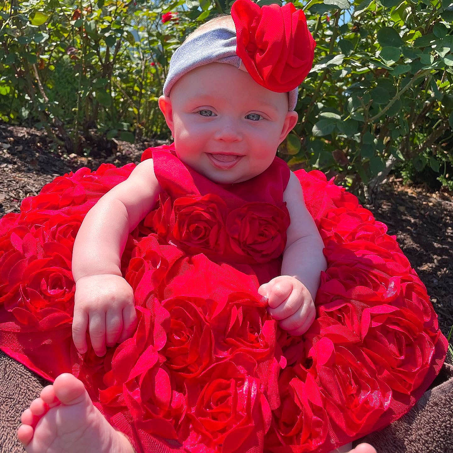 Emelia joined the competition — help win amazing prizes! baby, baby_toddler_clothing, cap, child, costume_hat, dress, flower, grass, happy, hat, head, headgear, headwear, leaf, magenta, people_in_nature, person, pink, plant, red