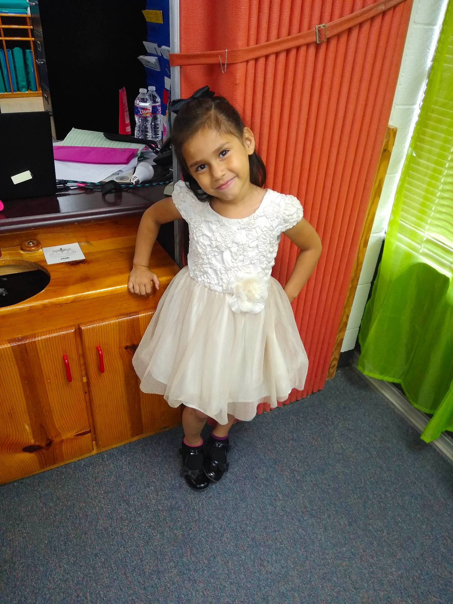 Clara is registered to the contest to win money with this photo: child, dress, joy, leg, person, room, skin, smile, toddler