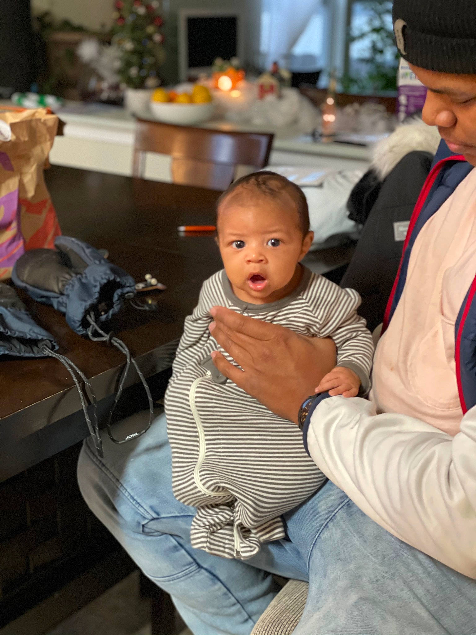 Zakai is registered to the contest to win money with this photo: baby, baby_products, baby_toddler_clothing, beanie, bonnet, cap, child, comfort, costume_hat, family, fedora, holiday, houseplant, knit_cap, lap, person, stuffed_toy, surprise, toddler, toy