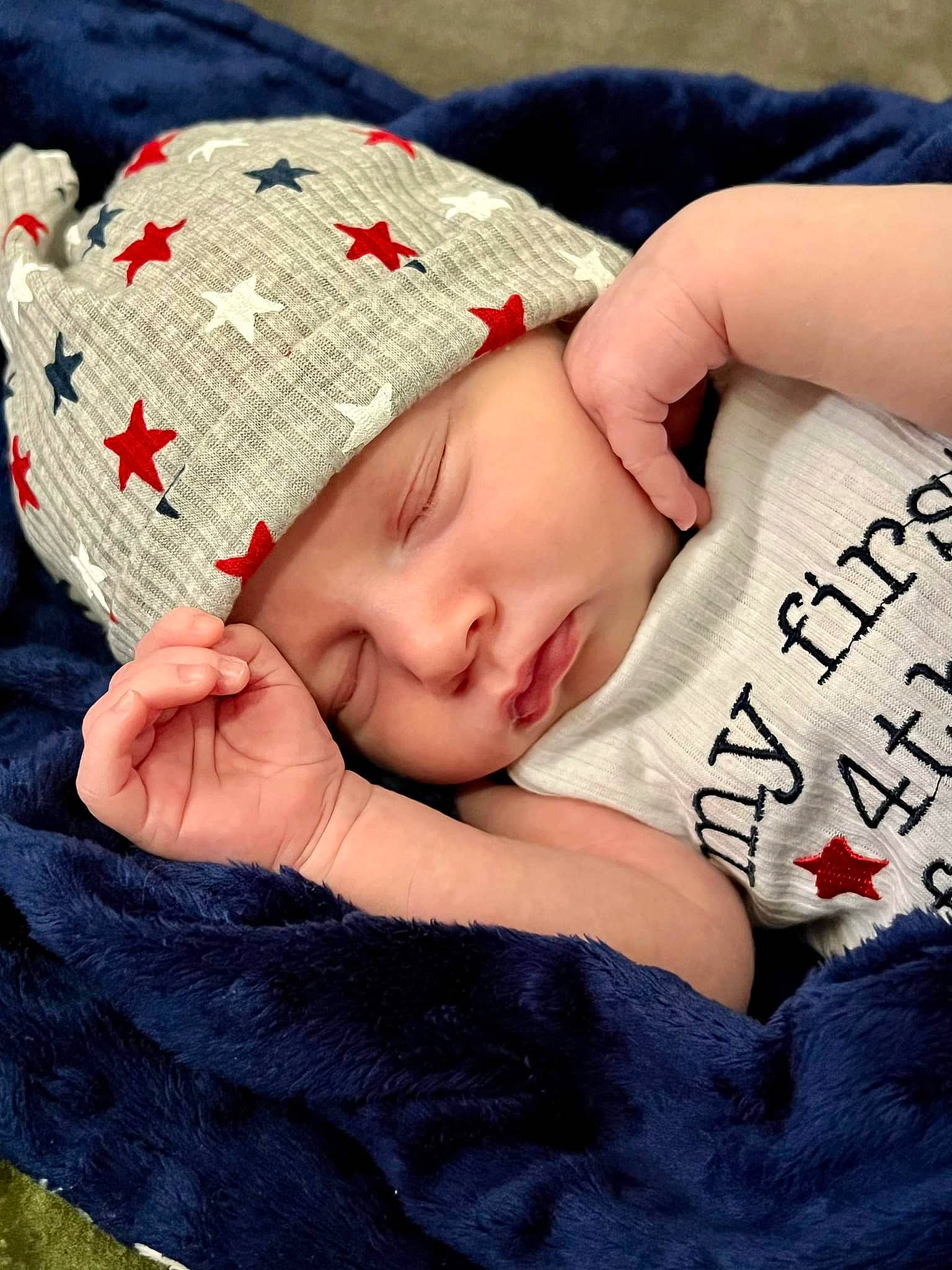 Jaxon is registered to the contest to win money with this photo: baby, baby_sleeping, baby_toddler_clothing, cap, comfort, couch, eye, eyelash, fashion_accessory, finger, hand, head, headwear, linens, lip, pattern, person, skin, sleeve, textile