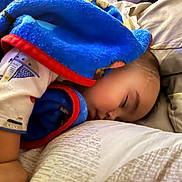 Elias is registered to the contest to win money with this photo: baby, bed, blanket, blue_blanket, child, closeup, comfortable, cozy, cute, face, indoor, infant, nap, peaceful, person, pillow, rest, sleeping, soft, toddler