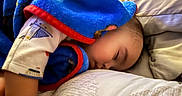 Elias is registered to the contest to win money with this photo: baby, bed, blanket, blue_blanket, child, closeup, comfortable, cozy, cute, face, indoor, infant, nap, peaceful, person, pillow, rest, sleeping, soft, toddler