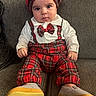 baby, bow_tie, child, couch, cute, expression, face, fashion, footwear, hat, indoors, person, plaid, portrait, red, sitting, slippers, texture, white_shirt, young