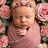 newborn, baby, sleeping, pink, blanket, flower_crown, roses, carnations, floral_arrangement, portrait, closeup, peaceful, soft_texture, headband, infant, cute, wrapped, hands, delicate, nature