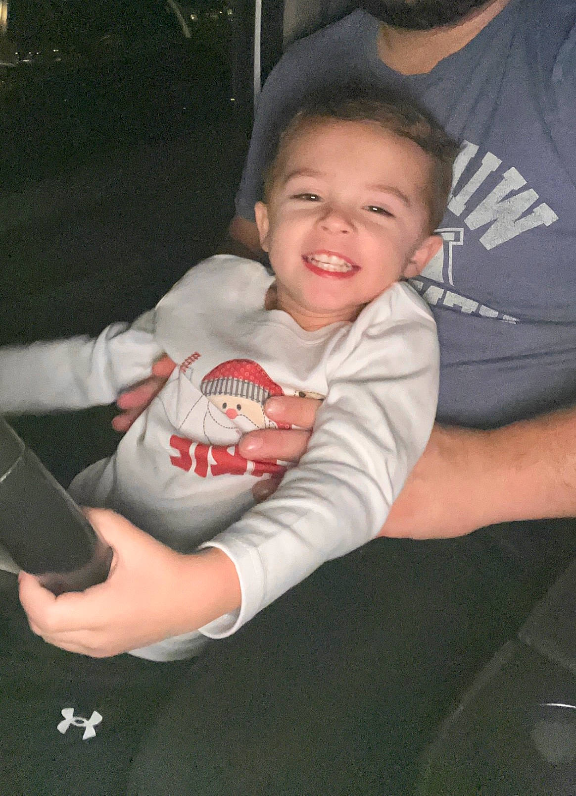 Arie is registered to the contest to win money with this photo: baby_toddler_clothing, cheek, child, comfort, cool, elbow, finger, flash_photography, fun, hand, happy, joy, lap, mouth, person, sitting, sleeve, smile, t_shirt, thigh