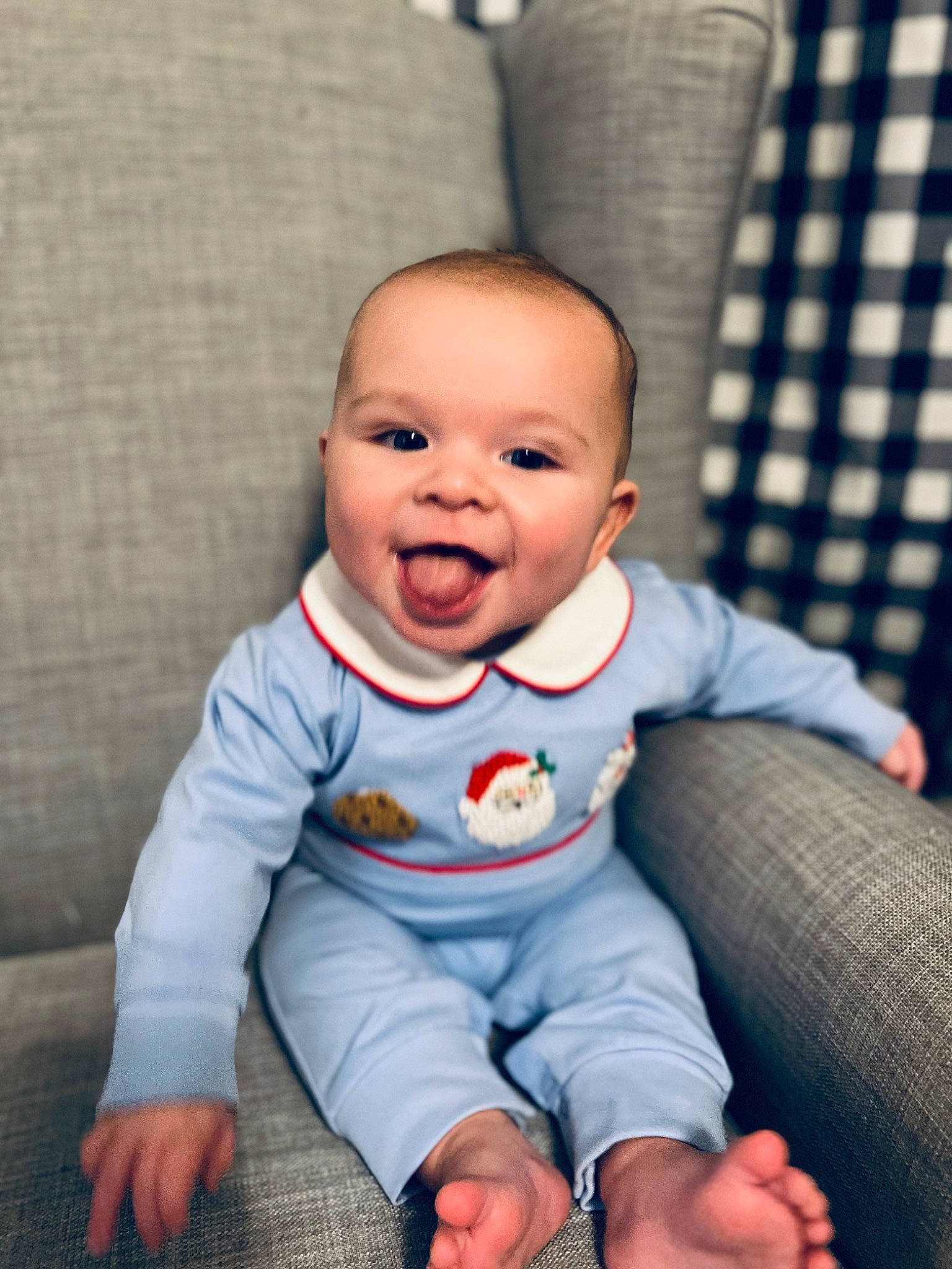 Charlie is registered to the contest to win money with this photo: baby, baby_toddler_clothing, cheek, child, comfort, cool, eye, face, finger, flash_photography, flooring, happy, head, nose, person, sitting, skin, sleeve, smile, t_shirt