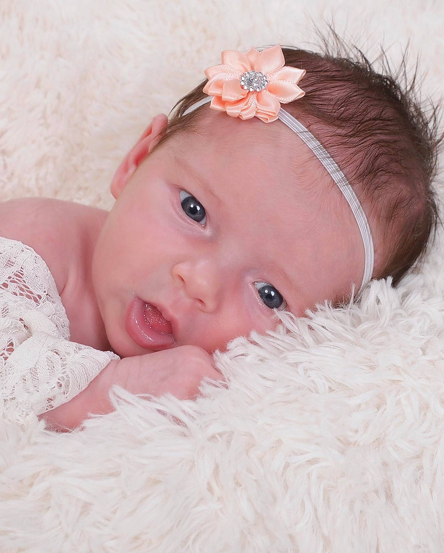 Aubrey Rae is registered to the contest to win money with this photo: baby, baby_toddler_clothing, cheek, chin, eye, eyebrow, eyelash, face, hair, head, headband, headgear, headpiece, iris, lip, person, petal, pink, skin, textile