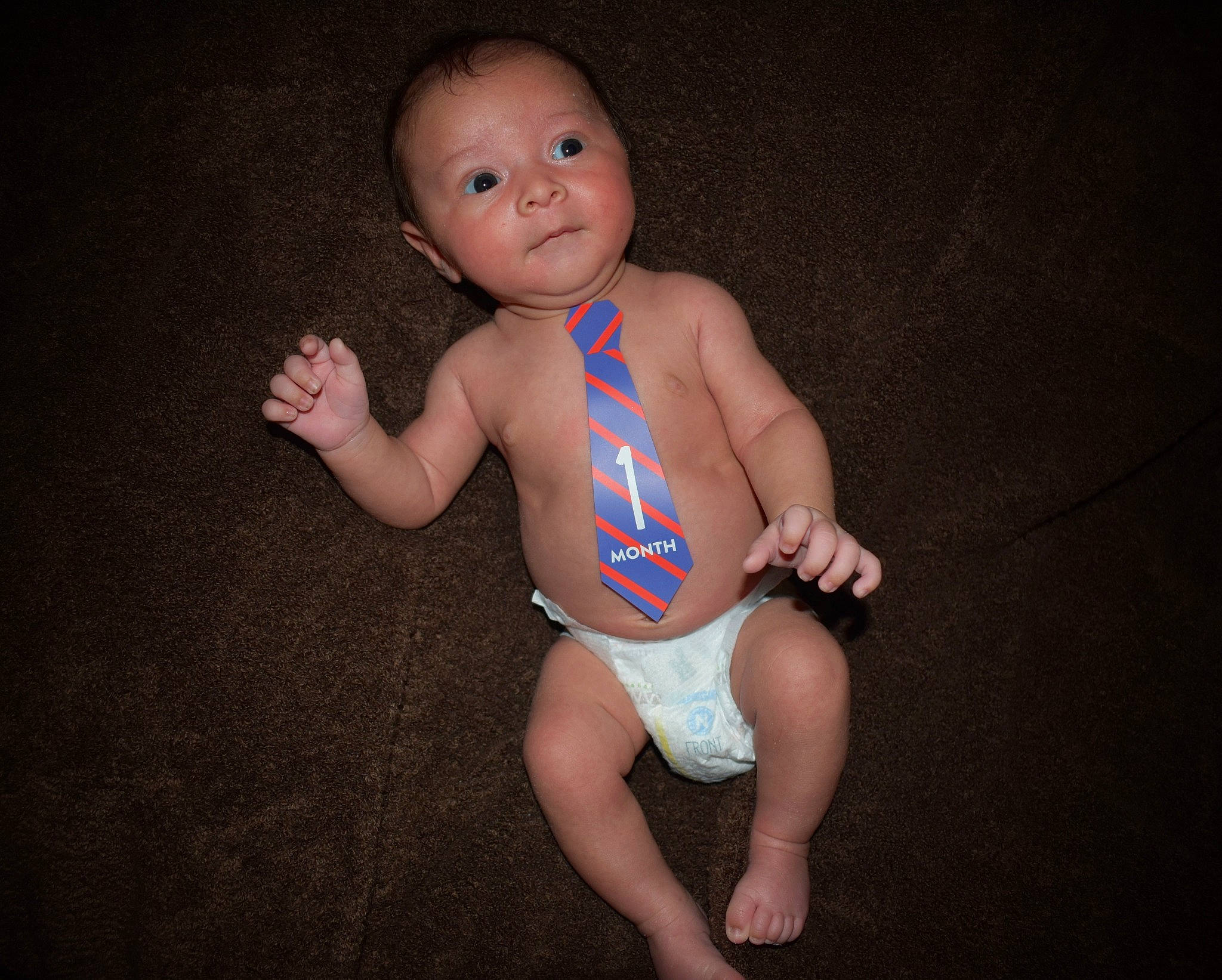 Elijah is registered to the contest to win money with this photo: baby, baby_toddler_clothing, barefoot, child, diaper, joint, leg, leotard, person, sitting, standing, swimwear, thigh, toddler