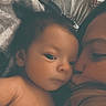 Jake is registered to the contest to win money with this photo: adult, affection, baby, blanket, bond, child, closeup, comfort, cuddle, face, family, gentle, indoor, kiss, love, person, portrait, rest, skin, tenderness